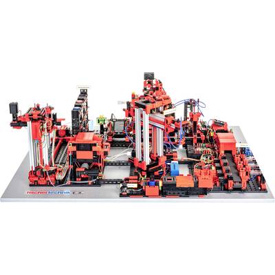 Une machine complexe avec des composants robustes rouges et noirs, câblée et mécanisée, montée sur une base grise.