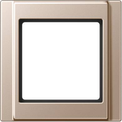 Un cadre d'interrupteur carré couleur bronze, aux angles arrondis et avec une surface intérieure blanche.