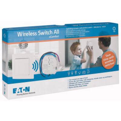 'Commutateur sans fil All xComfort' - Emballage contenant un ensemble de commutation sans fil. L'impression indique les appareils compatibles et un schéma de l'installation.
