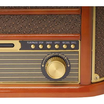 Gros plan sur une radio rétro avec un grand bouton rotatif et plusieurs touches de fonction pour la lecture, la pause et l'enregistrement.