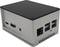 Un petit ordinateur mini-PC rectangulaire dans un boîtier argenté avec plusieurs ports, notamment USB, HDMI et Ethernet.
