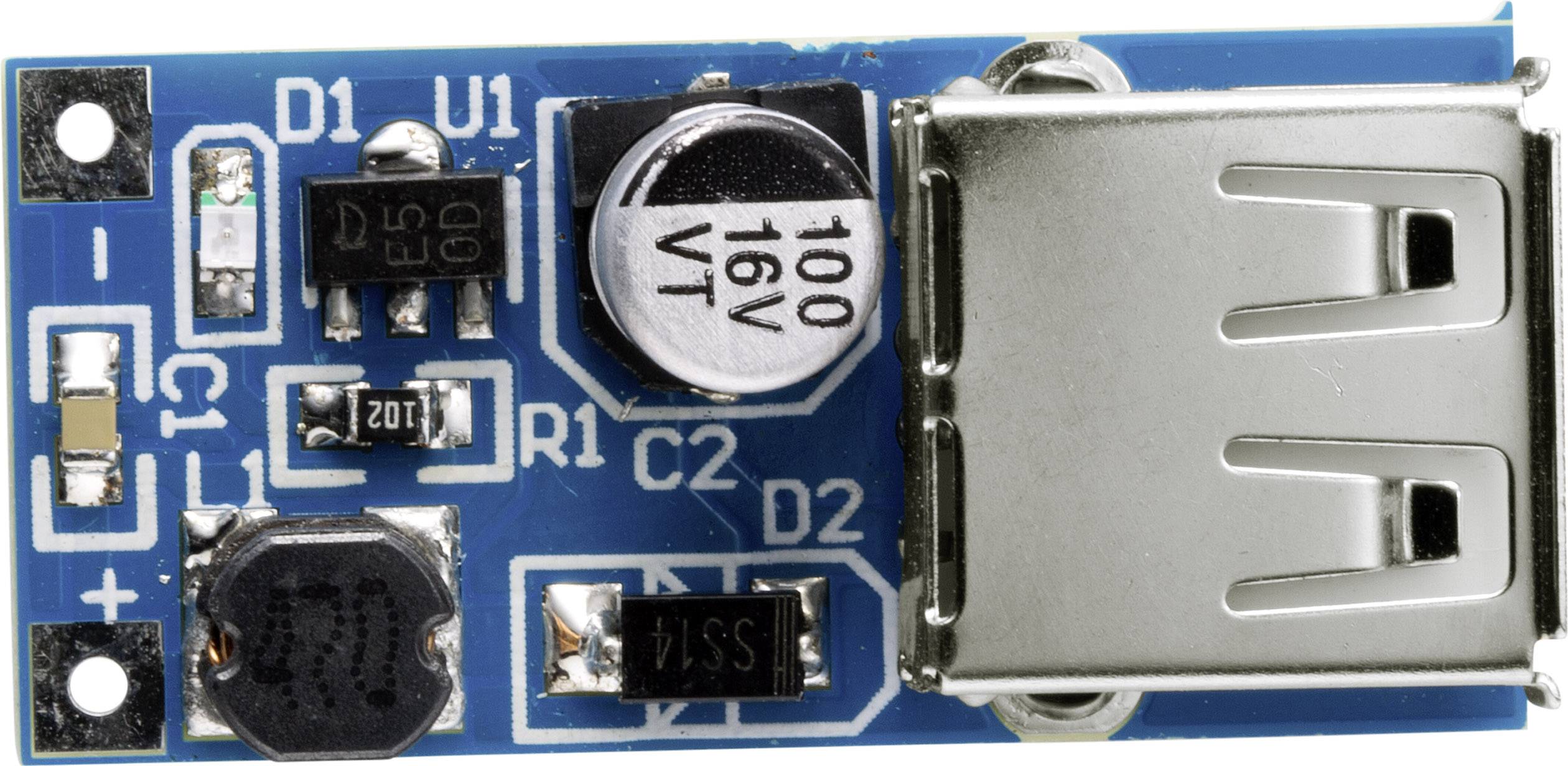 Une carte électronique bleue avec des composants électroniques, comprenant un port USB, un condensateur et plusieurs petits puces et résistances.