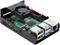 Un Raspberry Pi dans un boîtier avec ventilateur. On peut voir des ports USB, HDMI et Ethernet ainsi qu'un système de refroidissement au-dessus de la carte.