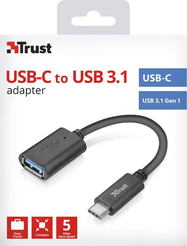 Emballage de l'Adaptateur Trust USB-C vers USB 3.1. Montre un câble avec des connecteurs USB-C et USB-A. Caractéristiques mises en avant : 'Voyage', 'Compact'.