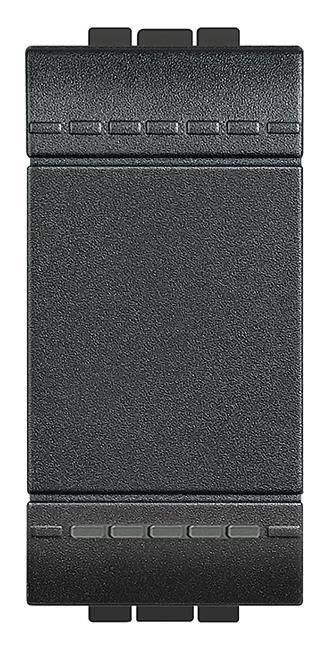 Un interrupteur noir, rectangulaire aux bords marqués, probablement partie intégrante d'un appareil électrique.