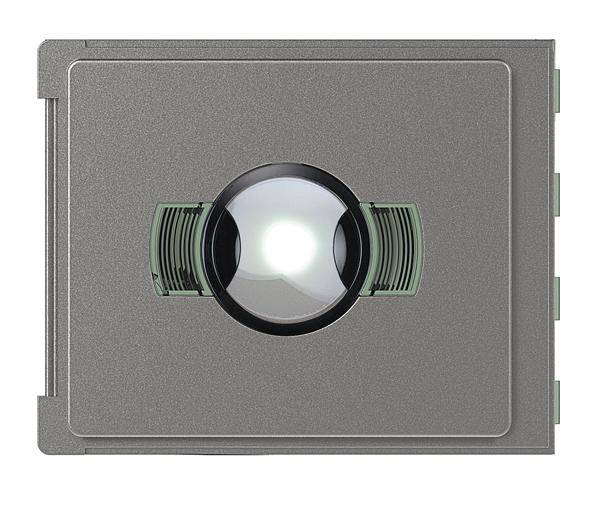 Appareil électronique gris avec un objectif lumineux centré et des accents verts de chaque côté de l'objectif.