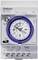 Une horloge électrique blanche avec un cadran bleu et des inscriptions noires pour les réglages horaires, fabriquée en Allemagne.