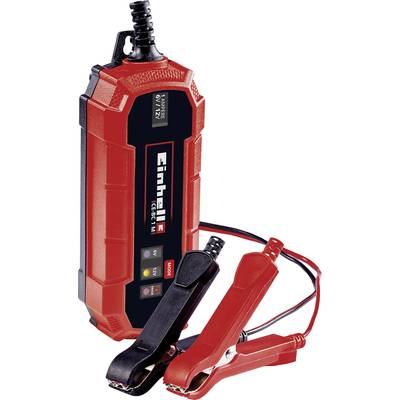 Un chargeur de batterie rouge Einhell avec deux pinces, robuste et compact. Idéal pour charger les batteries de véhicules.
