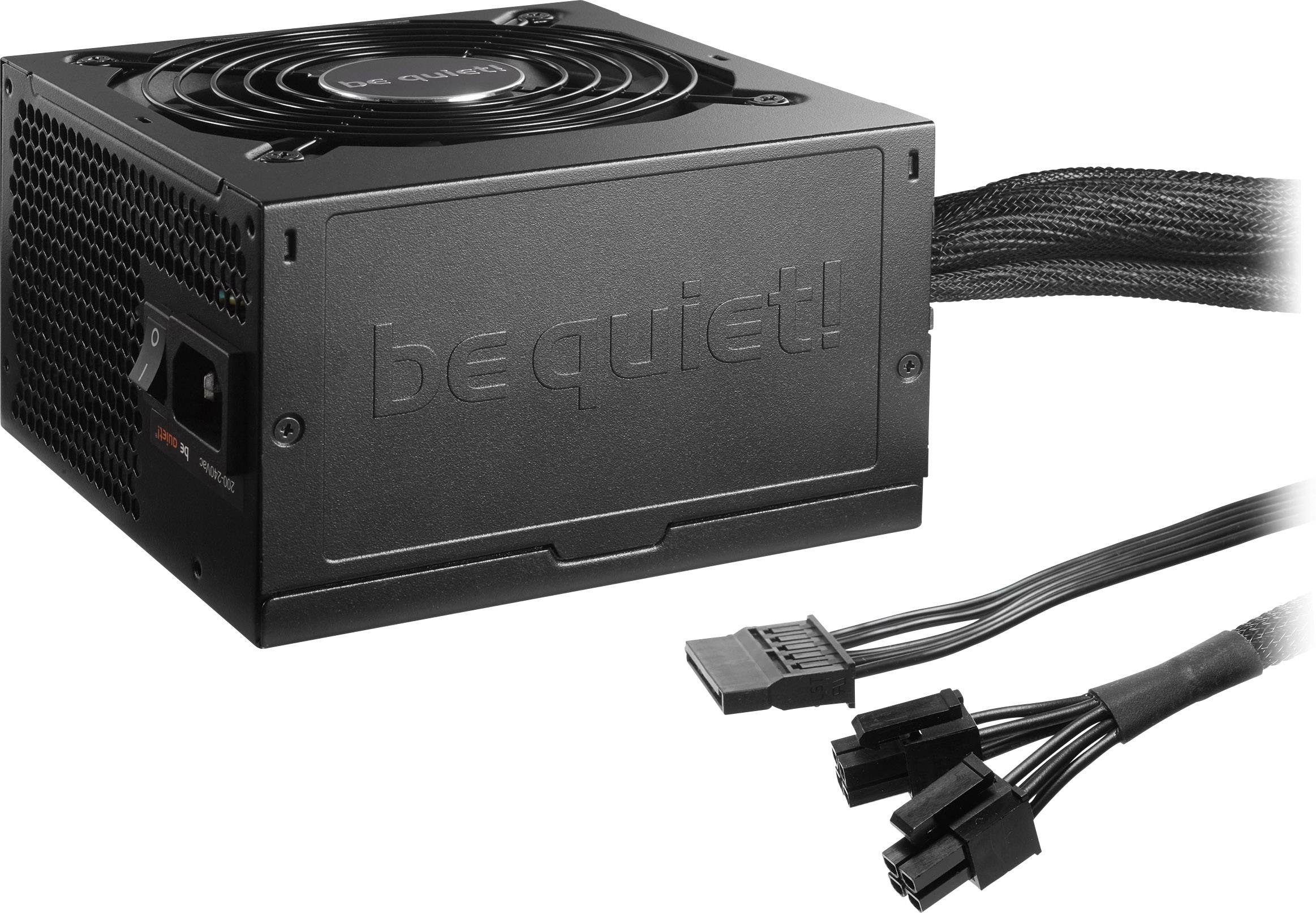 Bloc d'alimentation PC noir avec ventilateur en haut et plusieurs câbles à droite. Inscription sur le boîtier « be quiet! ».