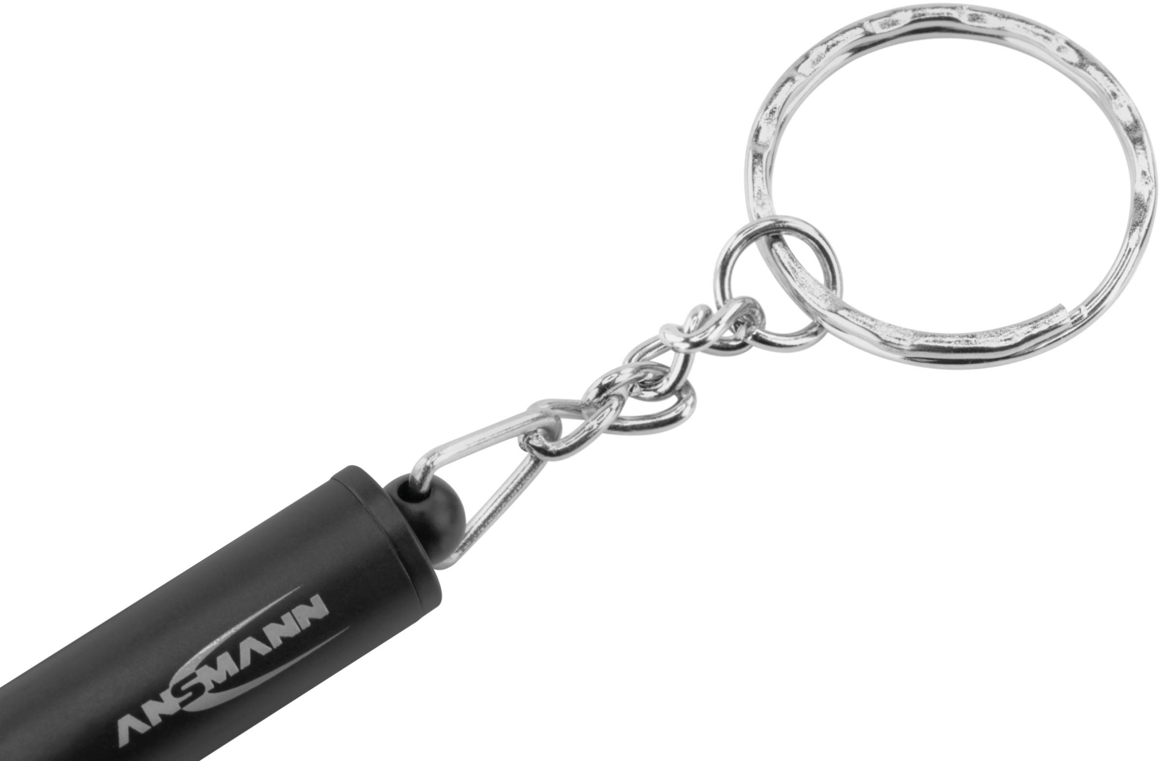 Porte-clés avec une barre noire portant l'inscription 'ANSMANN' et un anneau argenté.