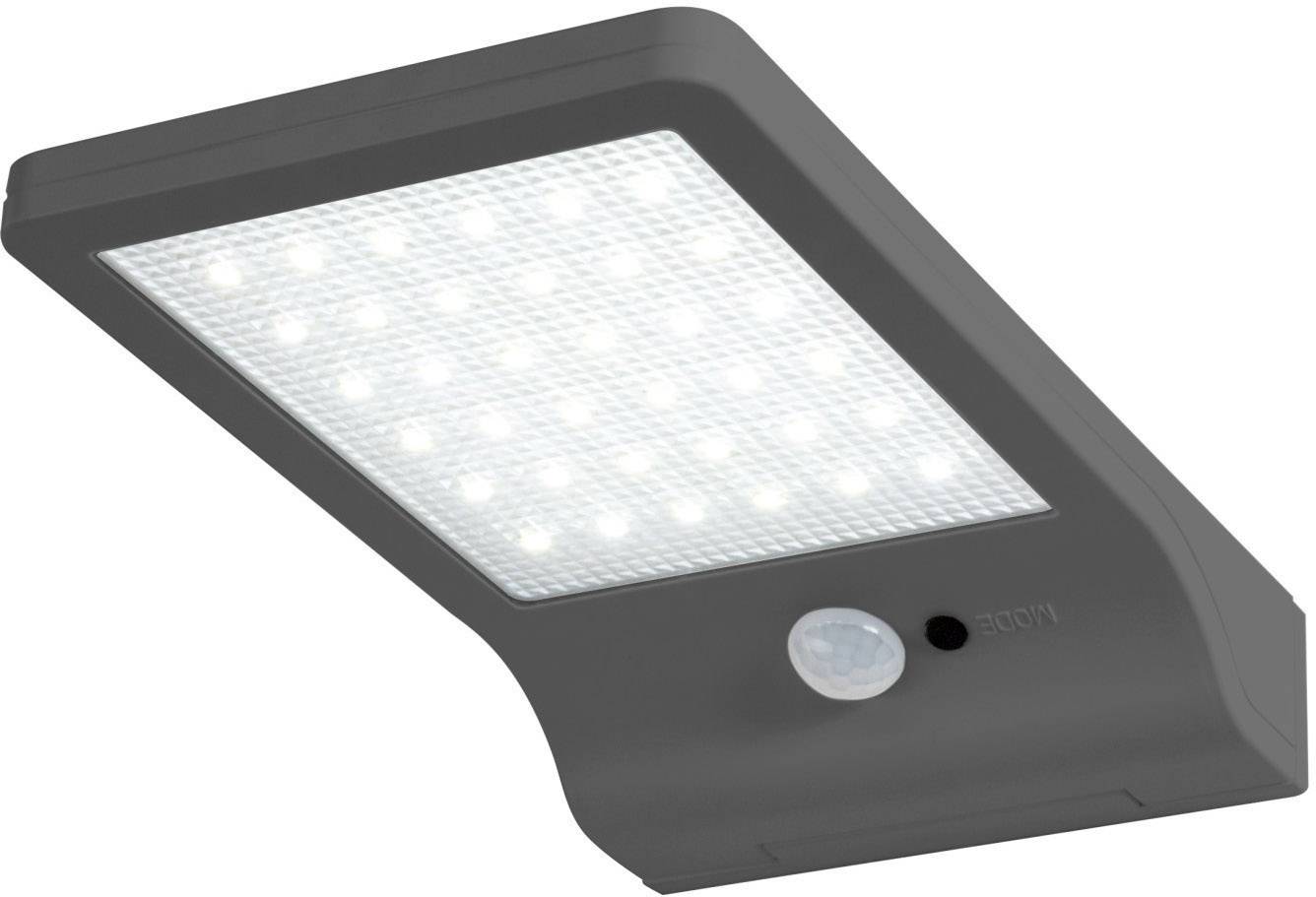 Lampe solaire verte avec capteur, idéale pour l'éclairage extérieur, avec zone de LED lumineuse.