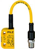 Un capteur jaune portant l'inscription 'PILZ' avec un câble de connexion noir. Le capteur porte des détails techniques imprimés.