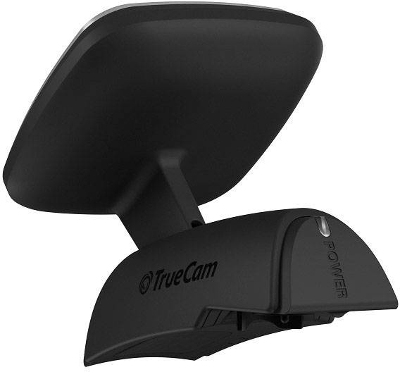 Une caméra de tableau de bord noire TrueCam montée sur un support de pare-brise, prête à enregistrer des vidéos pendant la conduite.