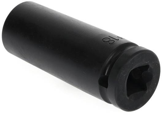 Pièce cylindrique noire, probablement un écrou à douille, avec une ouverture hexagonale et une empreinte numérique, posée en biais.