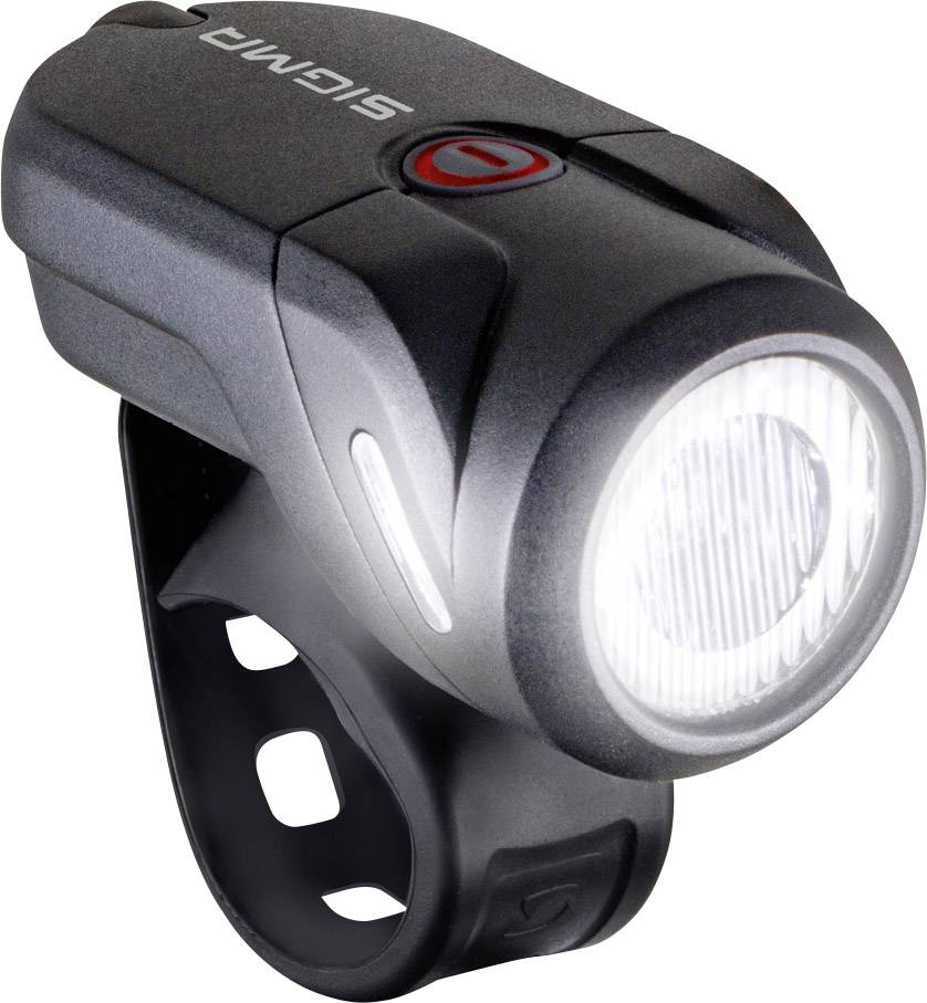 Un phare de vélo noir à LED avec support, brillant dans une lumière vive. Logo de marque 'SIGMA' visible sur le dessus.