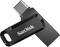Clé USB de SanDisk avec un capuchon rotatif protégeant le connecteur. Design compact pour un transfert de données facile.
