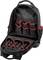 Un sac à dos noir ouvert avec des coutures rouges. À l'intérieur, plusieurs compartiments sont visibles, adaptés pour organiser des outils ou des accessoires.