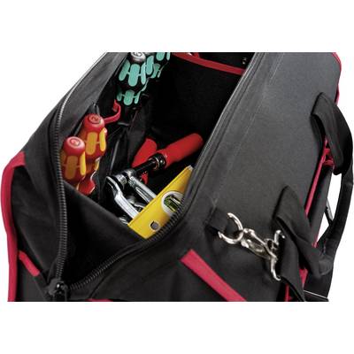 Un sac à outils ouvert rempli de divers outils, comprenant des tournevis et une pince.