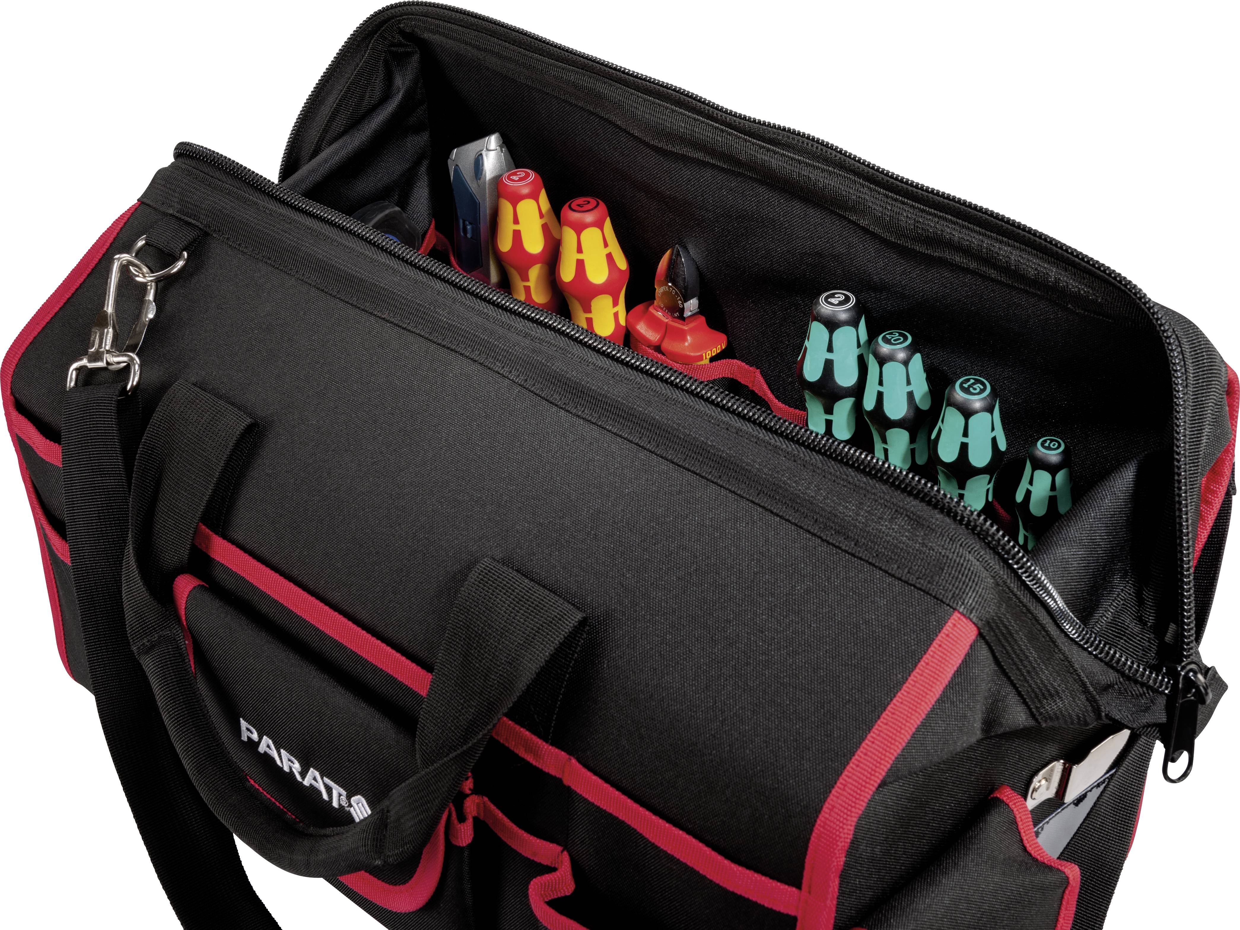 Un sac à outils noir avec des touches rouges, partiellement ouvert, révèle des outils rangés à l'intérieur, tels que des tournevis de différentes couleurs.