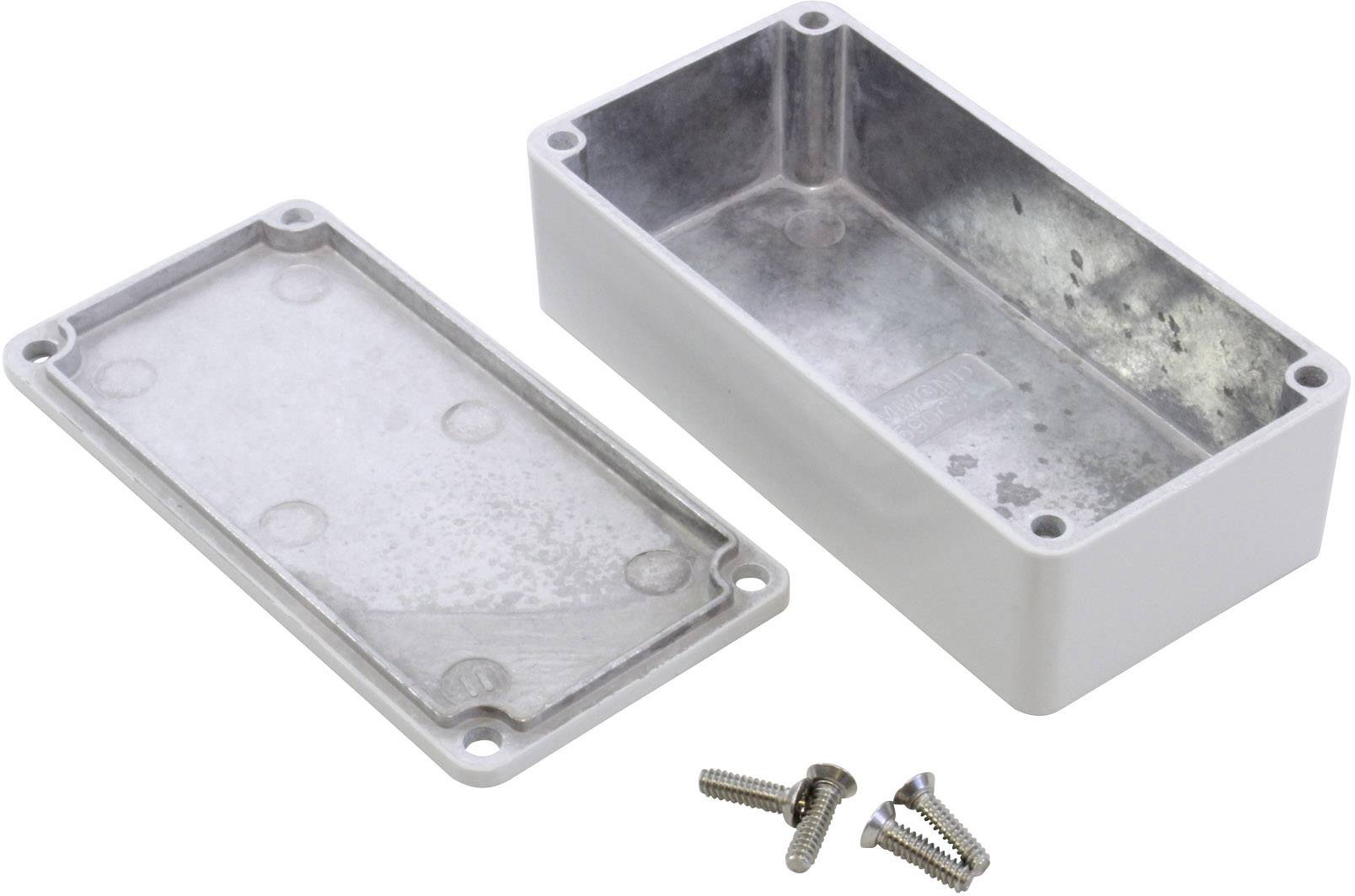 Boîtier métallique rectangulaire ouvert avec couvercle retiré et quatre vis placées devant. Adapté aux applications électroniques.