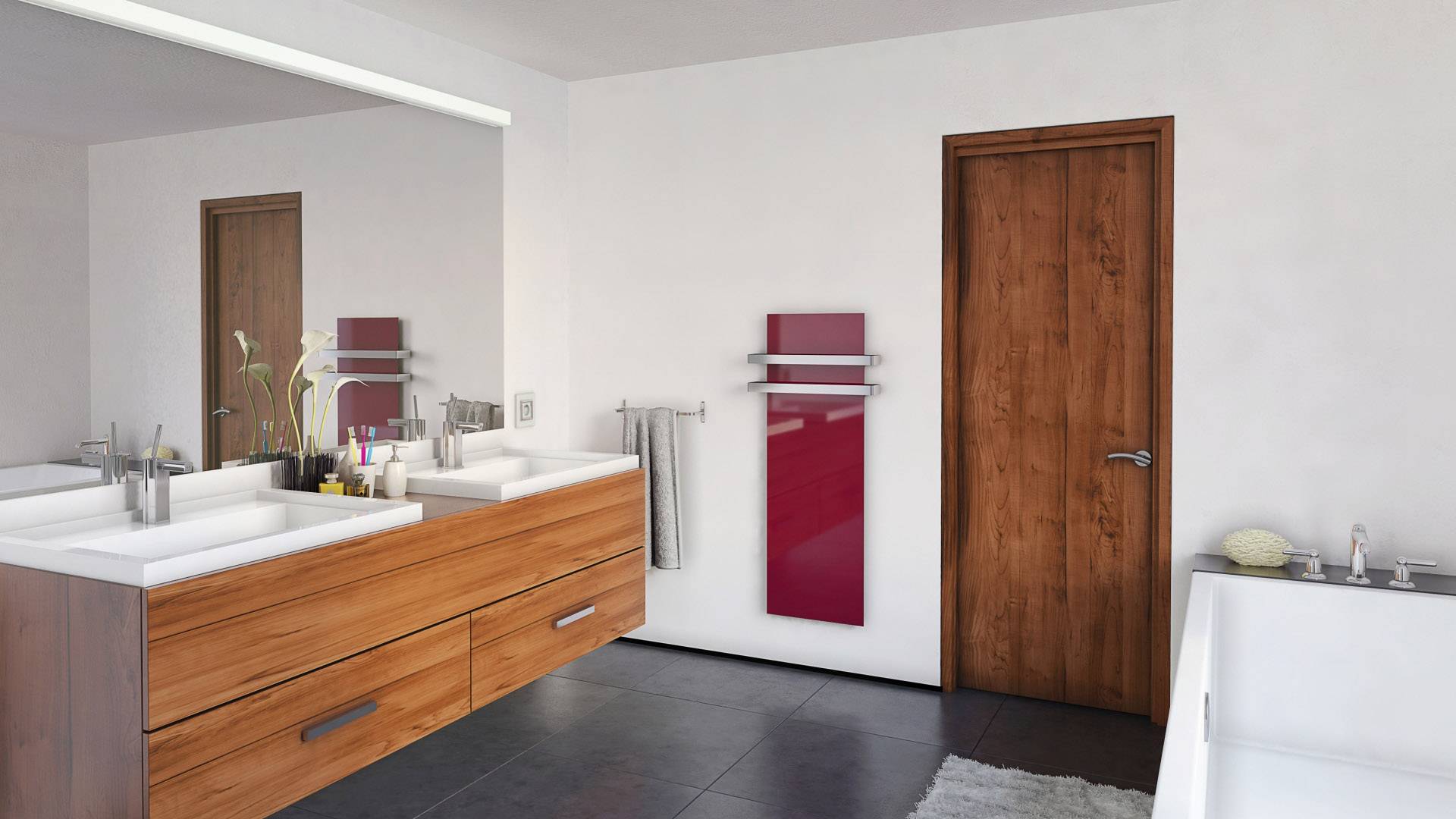 Salle de bain moderne avec double vasque en bois, porte-serviettes rouges au mur et baignoire blanche sur un sol sombre.