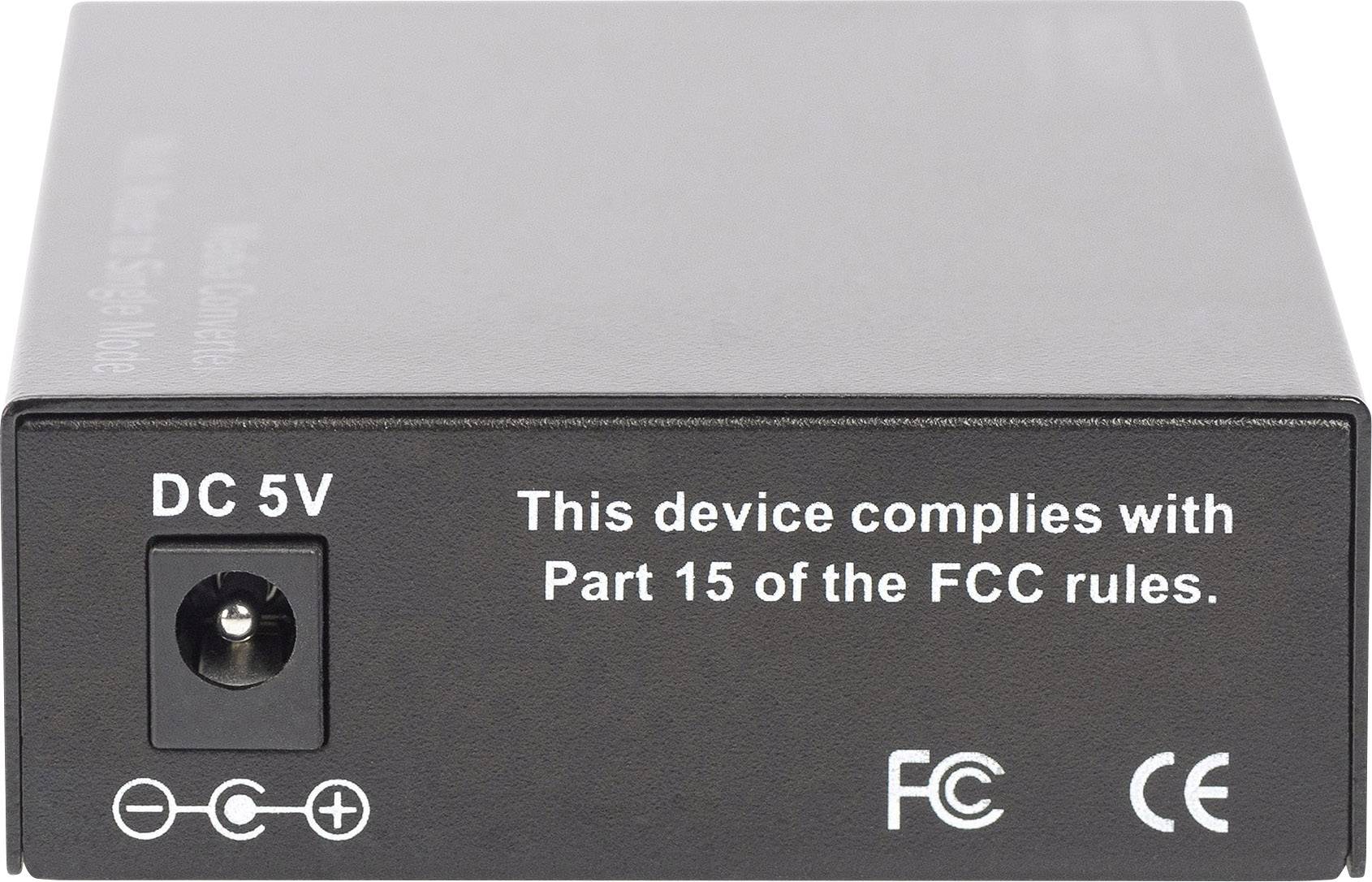 Appareil noir avec une prise de courant DC 5V réglable. Inscription : « Cet appareil est conforme à la Partie 15 des règles de la FCC ». Symboles FCC et CE.