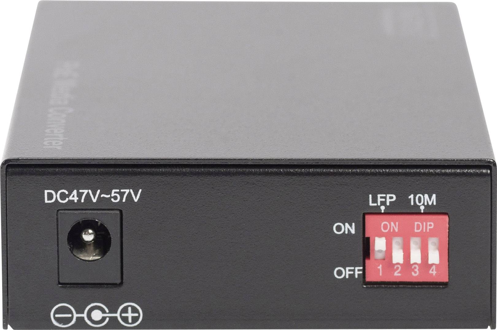 Un convertisseur de tension noir avec une entrée de 47V-57V CC, une connexion de fiche secteur à gauche et des interrupteurs DIP rouges à droite, posé sur une surface blanche.