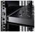 Un rack métallique noir perforé est monté dans un rack de serveur. Il montre une construction robuste pour les équipements informatiques.