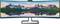 Un écran ultra-panoramique affiche un panorama de montagnes aux sommets enneigés et un coucher de soleil aux couleurs vives qui se reflète dans l'eau.