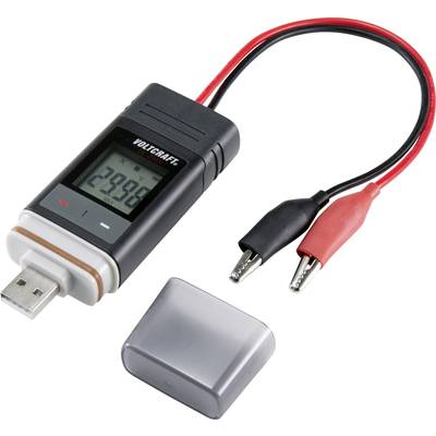 Appareil électronique avec port USB, affichage indiquant '29.99', deux câbles munis de pinces crocodiles, couvercle gris à côté.