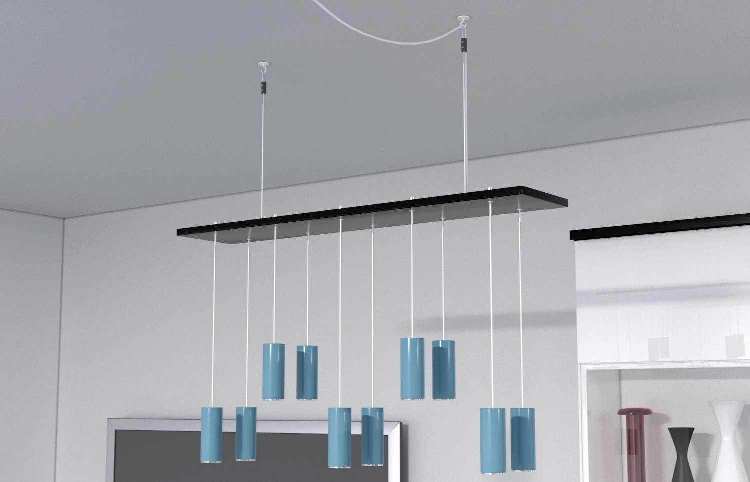 Lampe suspendue moderne avec des abat-jour cylindriques bleus, suspendus à partir d'un support de plafond rectangulaire.