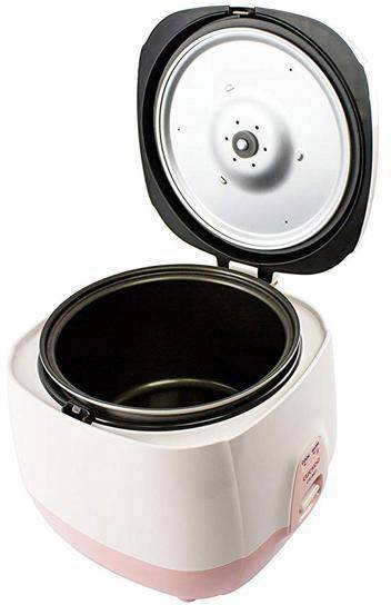 Cuiseur à riz et multicuiseur avec couvercle ouvert, montrant l'intérieur pour un nettoyage facile. Design beige avec des accents roses.