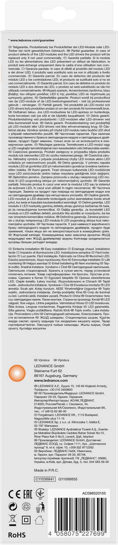 Dos de l'emballage avec un long paragraphe de texte contenant des instructions ou des informations sur le produit. En bas, des symboles et un code-barres sont visibles.