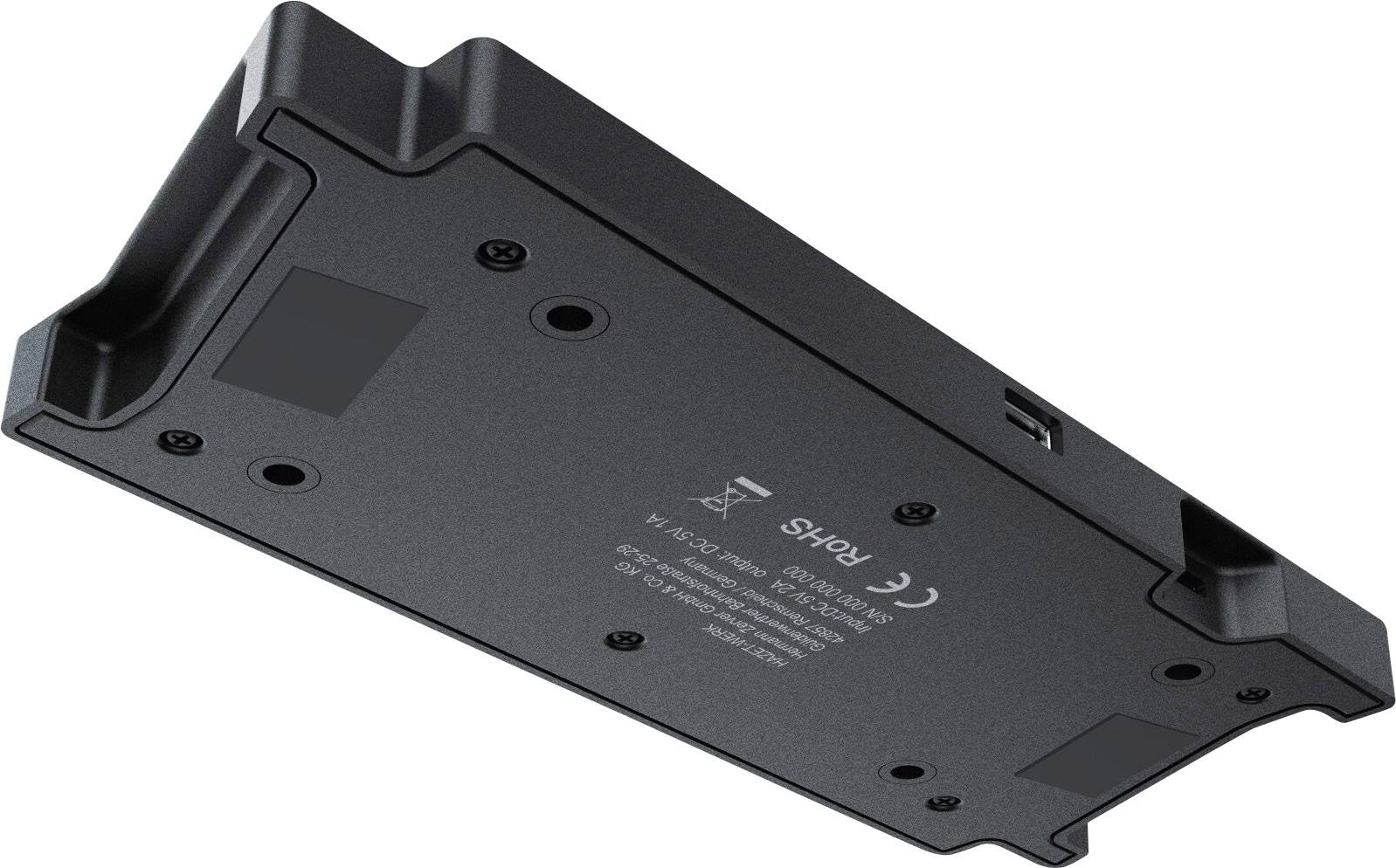 Une surface de charge électronique rectangulaire noire avec plusieurs options de connexion et marquage CE sur sa face inférieure.