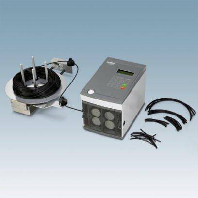 'Machine à attacher les câbles avec support de bobine et attaches de câbles.'