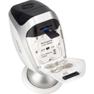 Un appareil avec un compartiment de batterie ouvert, montrant une batterie lithium-ion amovible et rechargeable avec un interrupteur marche/arrêt.