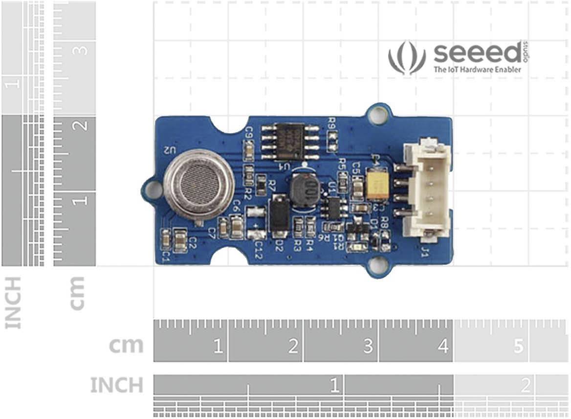 Gros plan d'un capteur sur une échelle de mesure avec des composants électroniques. En haut à droite, le logo de Seeed, 'The IoT Hardware Enabler'.