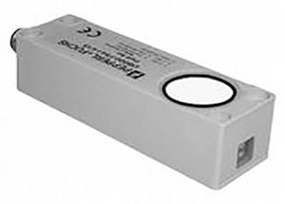 Un capteur électrique rectangulaire avec étiquette et connexion à l'arrière ; probablement utilisé dans un contexte industriel.