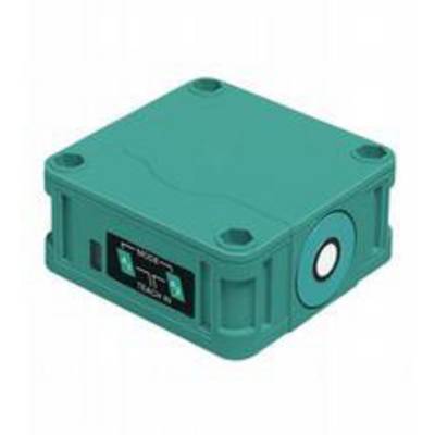 Petit haut-parleur carré vert avec des commandes et des connexions sur la face avant ; mobile et compact.