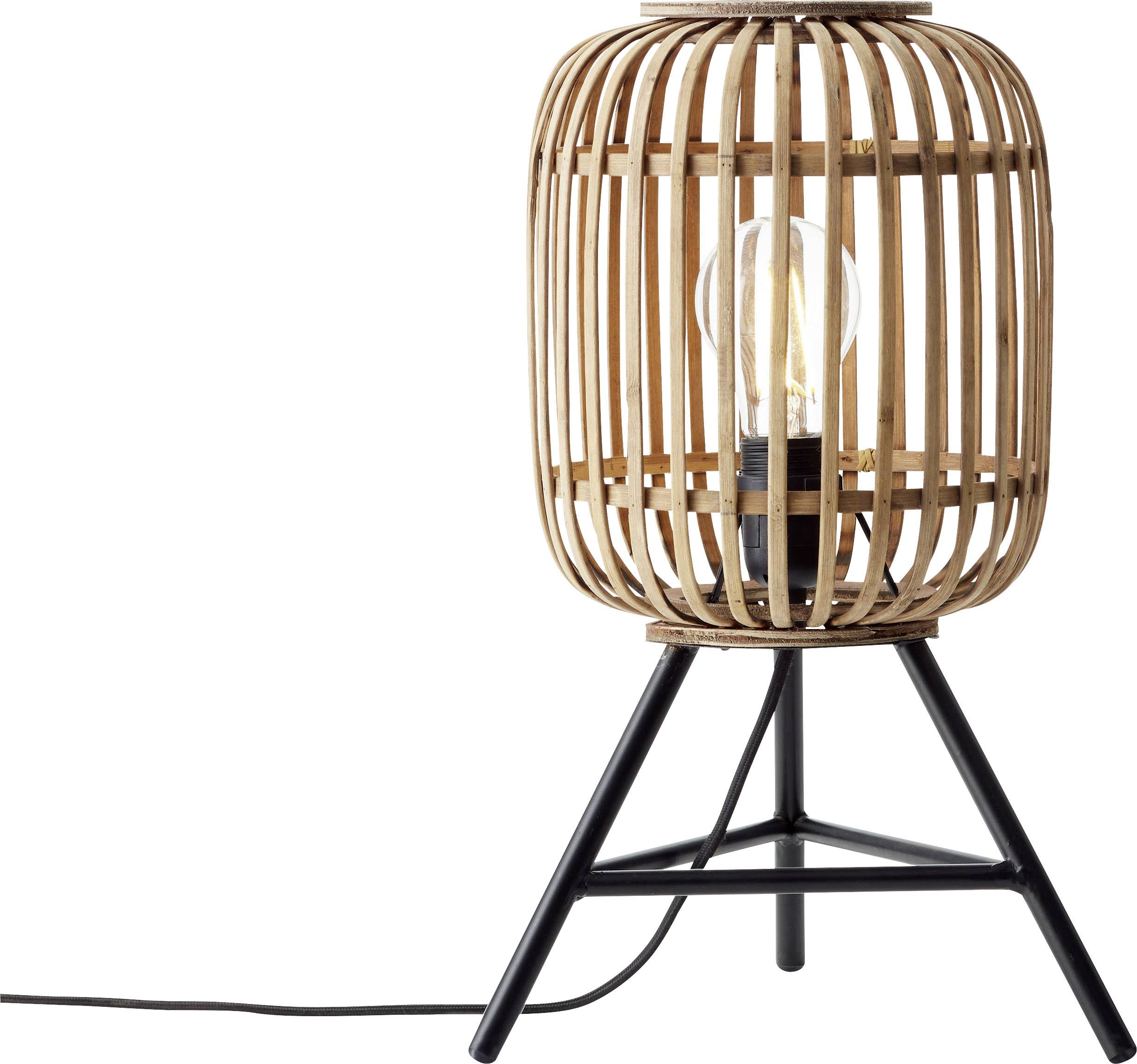 Une lampe de table avec un design en panier de bois posée sur un support métallique à trois pieds. Une ampoule est visible à l'intérieur de la structure en bois.