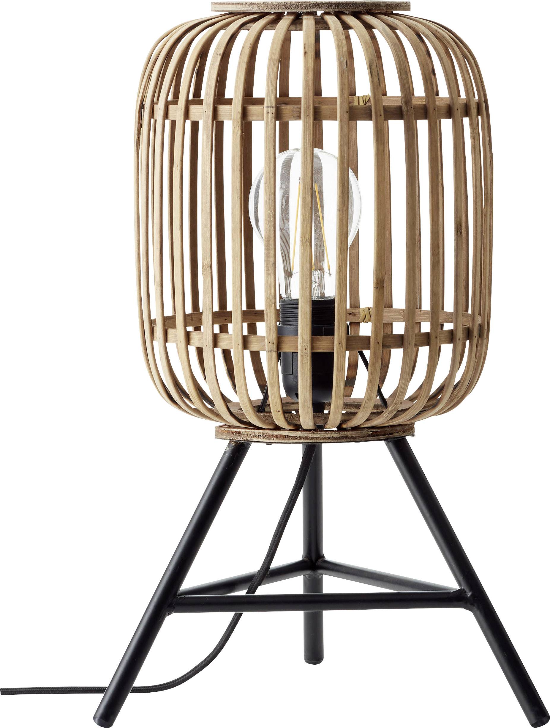 Lampe de table avec un trépied noir et un abat-jour cylindrique en bois tressé. Une ampoule visible est située à l'intérieur.