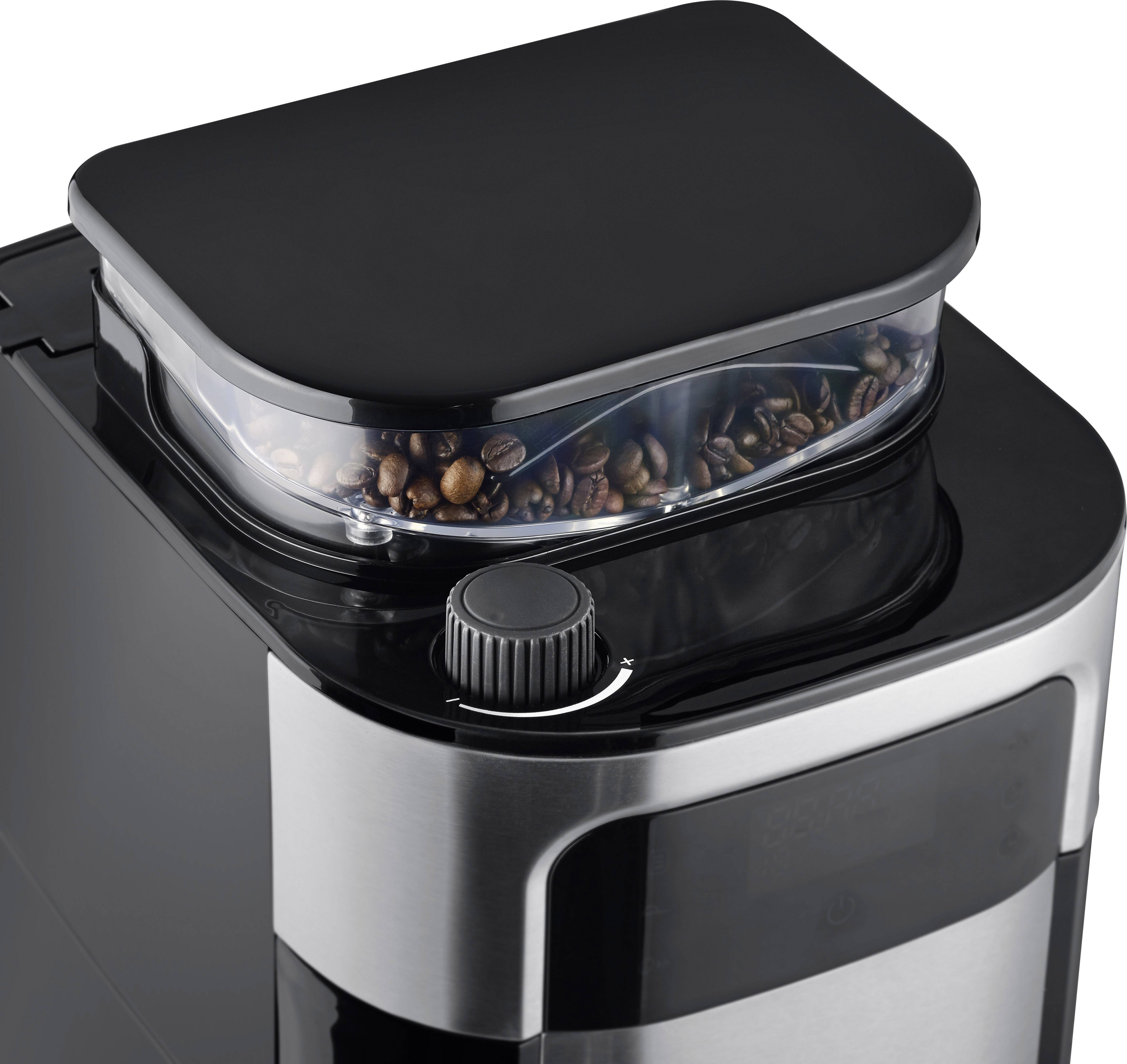 Une machine à café avec un compartiment à grains intégré et un bouton rotatif pour régler la finesse de mouture.