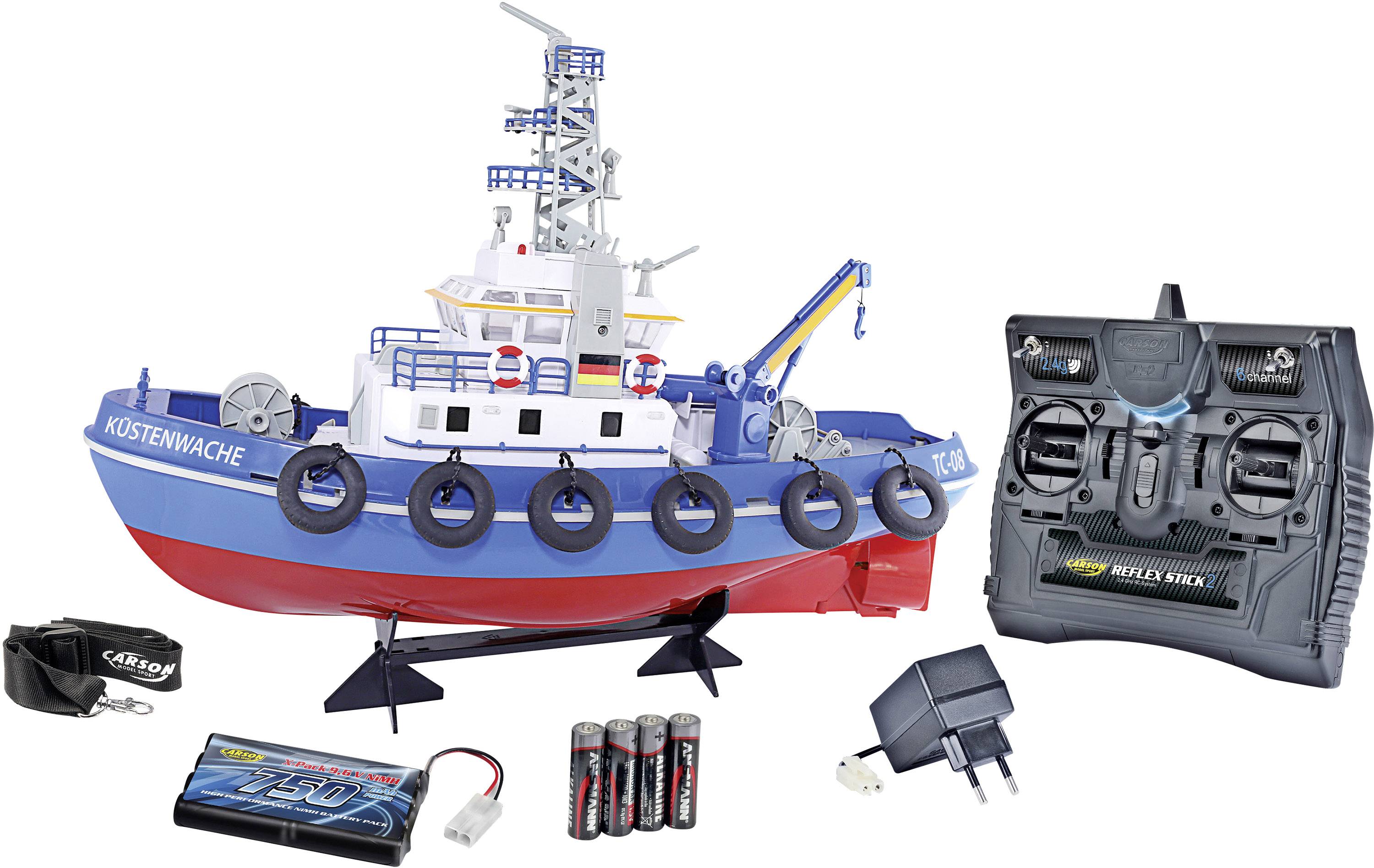 Modèle de bateau de sauvetage télécommandé avec piles, marqué 'Garde côtière'. Comprend également un chargeur et des accessoires.
