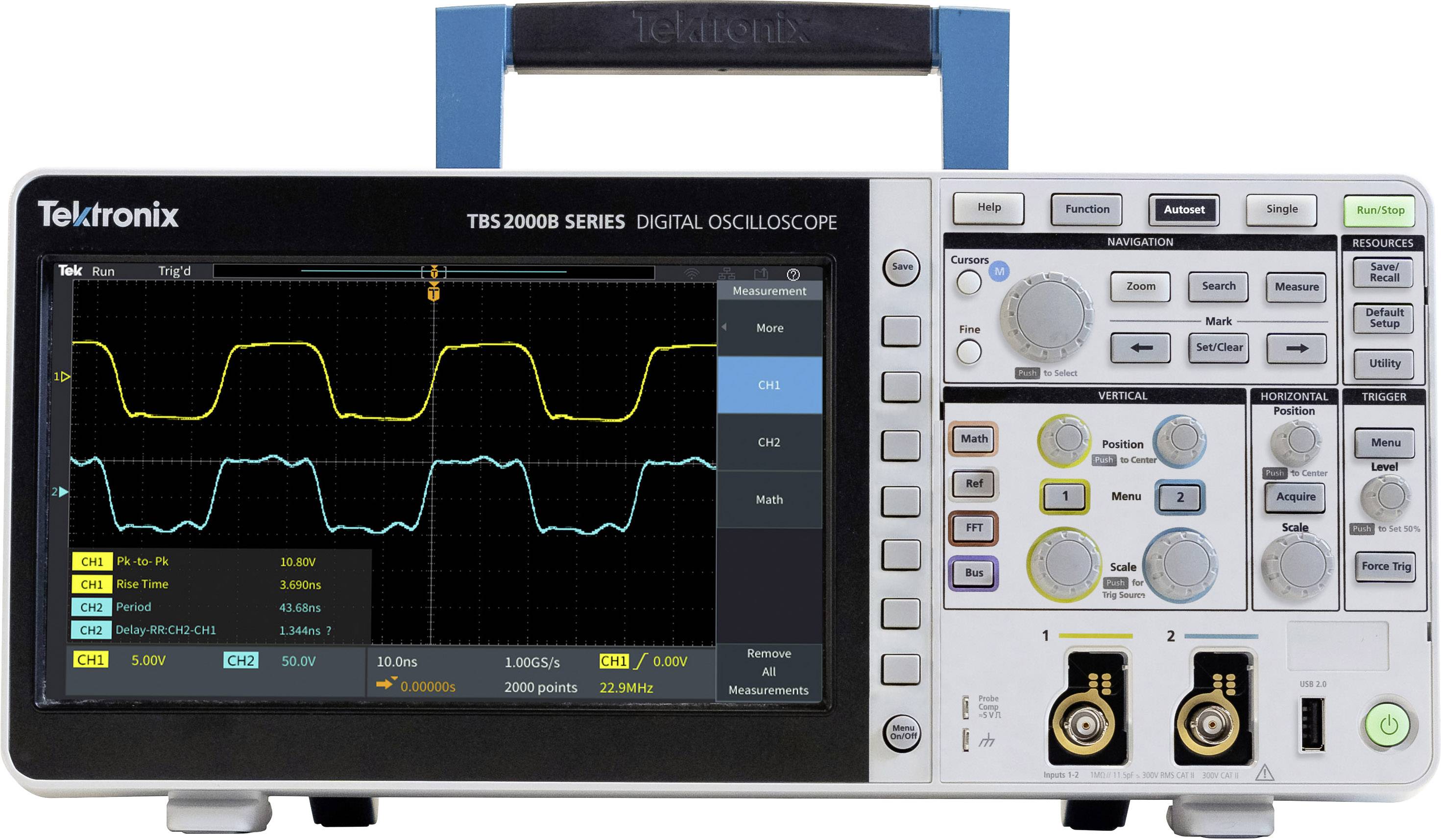 Oscilloscope numérique avec deux formes d'ondes à l'écran. Différents boutons de réglage et connexions sur le côté droit.