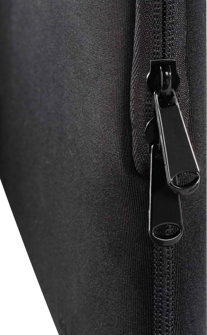 Fermeture éclair noire sur un sac ou un vêtement, gros plan, montrant les détails des dents et du curseur.