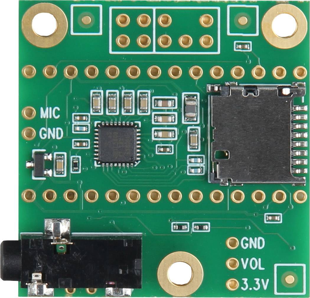 Une carte électronique verte avec différents connecteurs et une puce microprocesseur centrale. À gauche, un connecteur de microphone et un port de masse (GND).