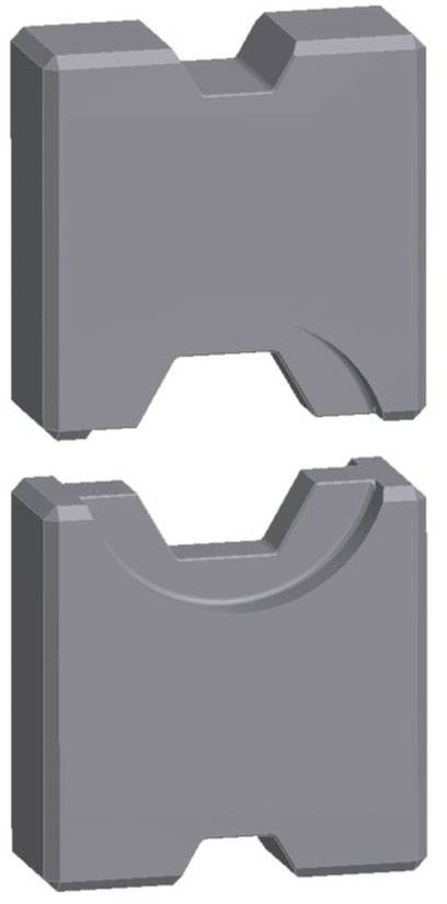 Blocs de métal gris rectangulaires avec des découpes différentes. Une encoche centrale en haut, une large cavité en bas.