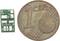 'Micropuce à côté d'une pièce de 1 centime montrant une comparaison de taille. La puce est nettement plus petite que la pièce et présente des marquages blancs.'