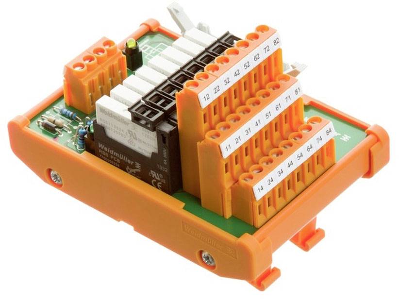 'Élément de connexion électronique avec plusieurs connexions colorées et numérotations sur un circuit imprimé.'