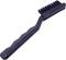 Une brosse métallique noire avec une poignée crantée en plastique, adaptée pour le nettoyage de petits endroits difficiles d'accès.